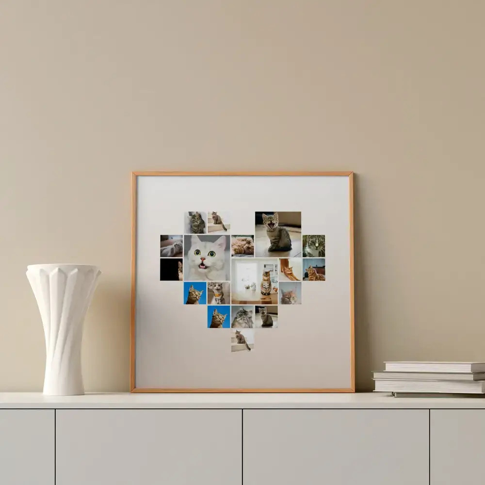 Herzförmige Katzen-Fotocollage im Naturholzrahmen auf einem Sideboard neben weisser Vase und Büchern