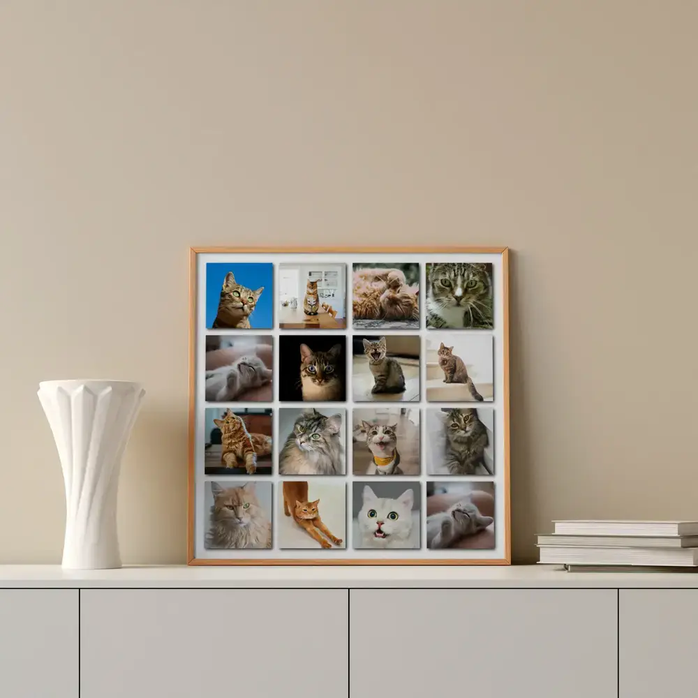 Collage mit 16 Katzenfotos im Holzrahmen auf weissem Sideboard neben Vase und Büchern, Geschenk für Katzenfreunde