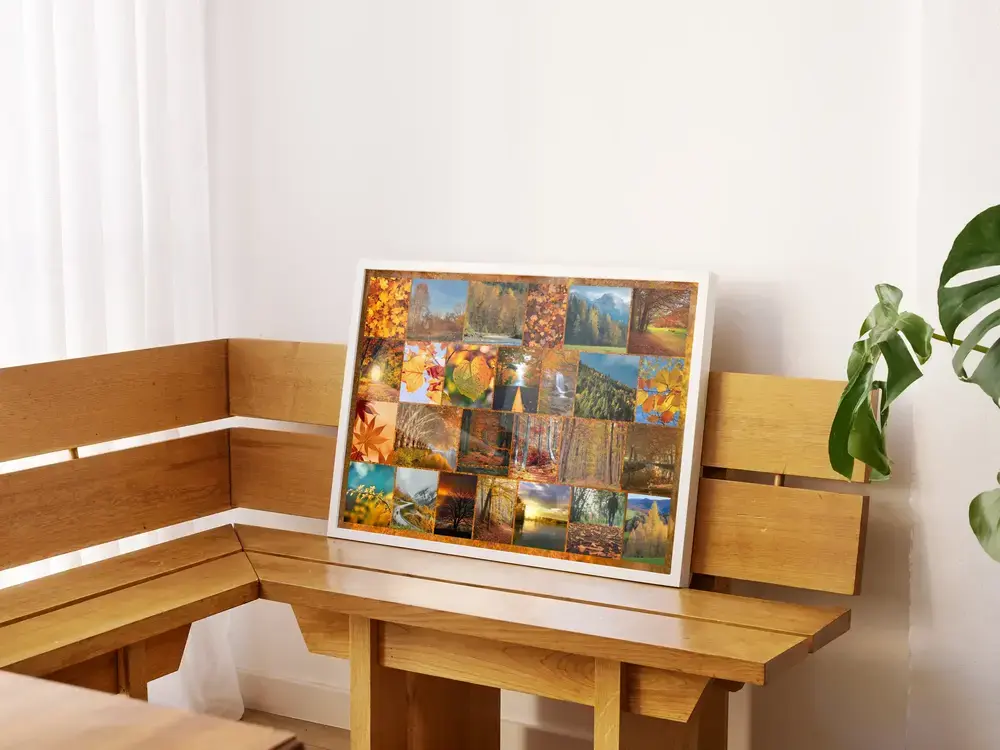 Herbstcollage mit Landschaftsfotos im hellen Rahmen auf einer Holzbank, eine Geschenkidee für Naturliebhaber