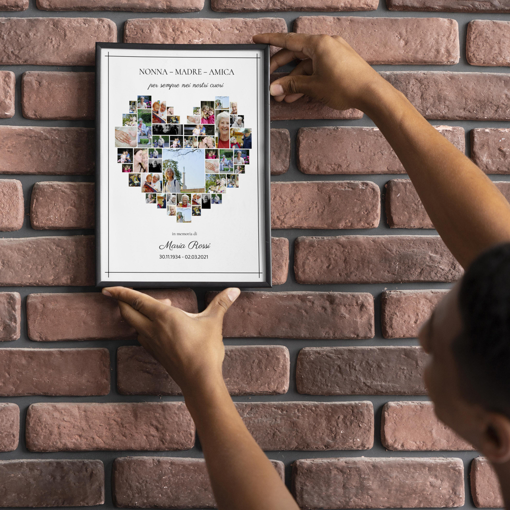 Collage commemorativo con foto a forma di cuore e nome personalizzato, in cornice nera su una parete di mattoni